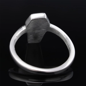 Macro detail of silver coffin gothic ring showing polished stainless steel inner texture