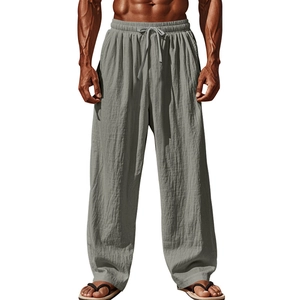 Detail of grey cotton linen pants featuring elastic waistband and adjustable drawstrings