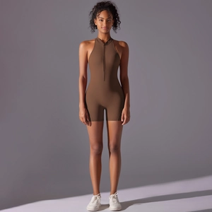 Close-up of coffee brown athletic romper with stand collar zipper and matte stretch fabric