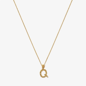 Detail of gold S925 silver letter Q pendant with hammered texture and tiny diamonds