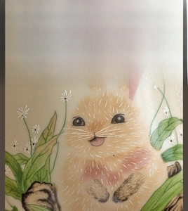 Macro detail of hand-painted bunny and daisy on Ru kiln ceramic tea cup with ice crackle glaze