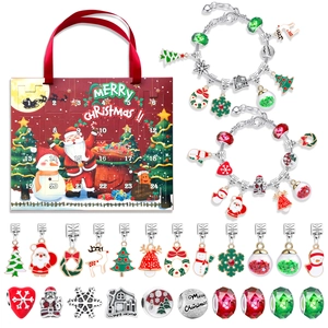 Detail view of 24-day Christmas advent calendar box with DIY bracelet charms and beads