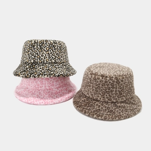 Winter faux fur leopard print bucket hats in yellow pink and brown plush textures