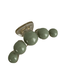 Minimalist bean green pearl hair claw clip with transparent base for elegant styling