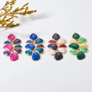 Detail of multi-color enamel floral leaf pendants with gold-plated stainless steel edges