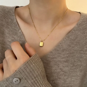 Vintage gold square pendant necklace with Chopin engraving on a delicate chain for women
