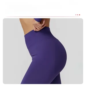 Detail of high-waist purple seamless yoga leggings with peach lift back seam design