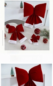 Detail of red velvet Christmas bows with white faux fur trim for holiday tree decor