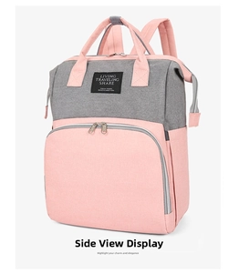 Detail view of large capacity oxford fabric backpack with pink and grey color-block design