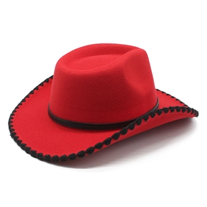 Close-up of red wool cowboy hat with black wavy edge stitching and slim hatband detail