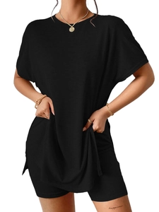 Detail of black leisure set showing the knitted texture of batwing top and shorts