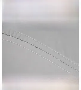 Detail of light gray quick-dry fabric showing double stitching and durable seam quality