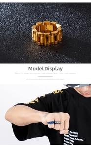 Macro detail of classic watch band style stainless steel rings in gold and blue finish