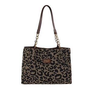 Large leopard print tote bag with brown leather straps and gold chain detail