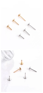 Close-up of polished stainless steel T-shape flat back stud earrings in gold and silver