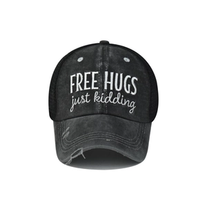 Detail of distressed trucker hat with FREE HUGS embroidery and breathable black mesh