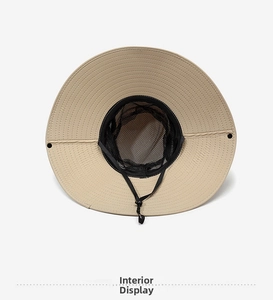 Detail of breathable black mesh lining and adjustable chin strap on khaki sun hat