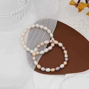 Elegant natural freshwater pearl bracelets with mixed colors on leather display padding