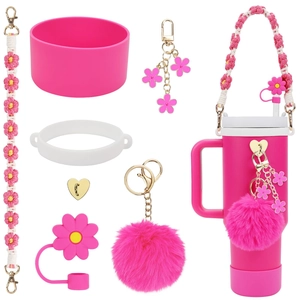 Detailed view of pink flower accessory kit for Stanley cups with silicone boot and charms