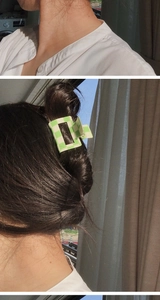 Detail of green and white checkered hair claw clip worn on hair for an elegant look