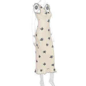 Detail of the ruffle trim and small bow on the floral print vintage dress
