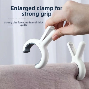 Detail showing the large opening and strong grip of the white heavy duty laundry quilt clip