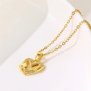 18k gold heart pendant necklace with shimmering zircon stones and wing design