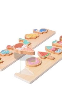 Close-up of thick wooden puzzle pieces showing ice cream and dinosaur themes for toddlers