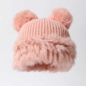Pink knit beanie with cute bear fur ears and fluffy plush trim for winter warmth