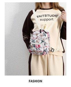 Detailed view of floral pattern on school backpack with adjustable shoulder straps