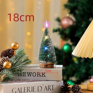 Close-up of 18cm lighted snow cedar Christmas tree with LED lights and wooden base