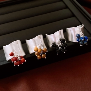 Irregular wide band rings with stone bead pendants in burgundy, yellow, black and blue