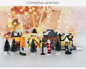 Detailliertes Weihnachtsdorf-Set mit LED-Häusern und Miniatur-Schneebäumen auf weißer Fläche