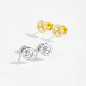 Macro detail of 925 silver stud earrings with white enamel and tiny inlaid stones