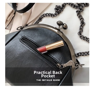 Detail view of the black lychee leather bag featuring a practical rear zipper pocket