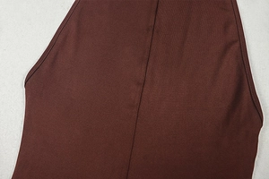 Close-up of the dark brown sleeveless neck cutting with precise double stitching details