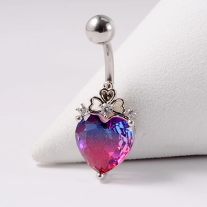 Silver navel ring with gradient heart-shaped gem and cubic zirconia crown on white stand