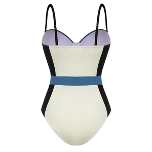 Slimming one-piece swimsuit in cream with black contrast side panels and blue waist stripe