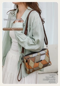 Detail of color-block shoulder bag featuring brown, beige, and olive PU leather panels