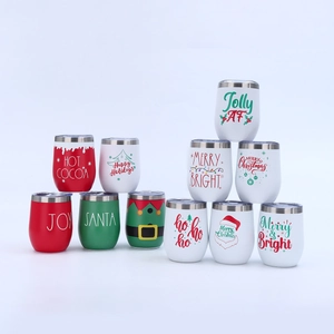 Close-up of stacked 12oz stainless steel egg mugs with various Christmas theme designs