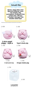 Detailed size chart of four mini pink resin pig ornaments for car dashboard decor