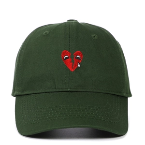 Dark green cotton baseball cap with broken heart embroidery and curved brim stitching