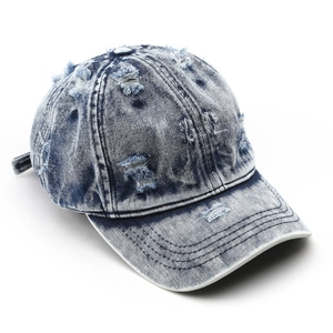 Vintage washed blue denim baseball cap with stylish distressed ripped details for outdoor wear