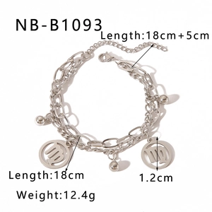 Macro detail of Virgo zodiac charm on a silver-tone double-layered stainless steel chain