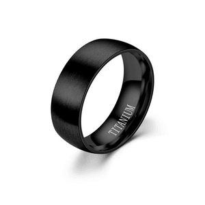 Men's matte black titanium ring with brushed finish exterior and polished inner band