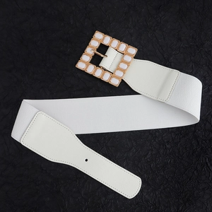 Detail of white wide elastic belt with gold square buckle and faux jade inlay