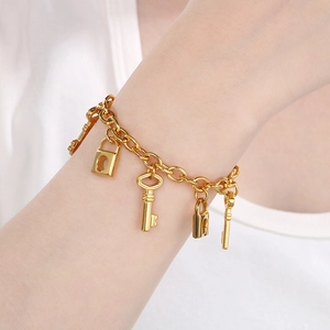 Chunky gold-plated chain bracelet with retro love heart, key, and lock charms for women
