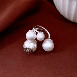 Vintage silver-tone open ring with four white pearls and Greek meander relief details