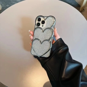 Sparkly silver iPhone case with 3D stacked hearts and glitter finish for iPhone 15 Pro Max