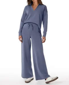 Women's blue knitted two-piece set featuring V-neck sweater and drawstring wide-leg pants